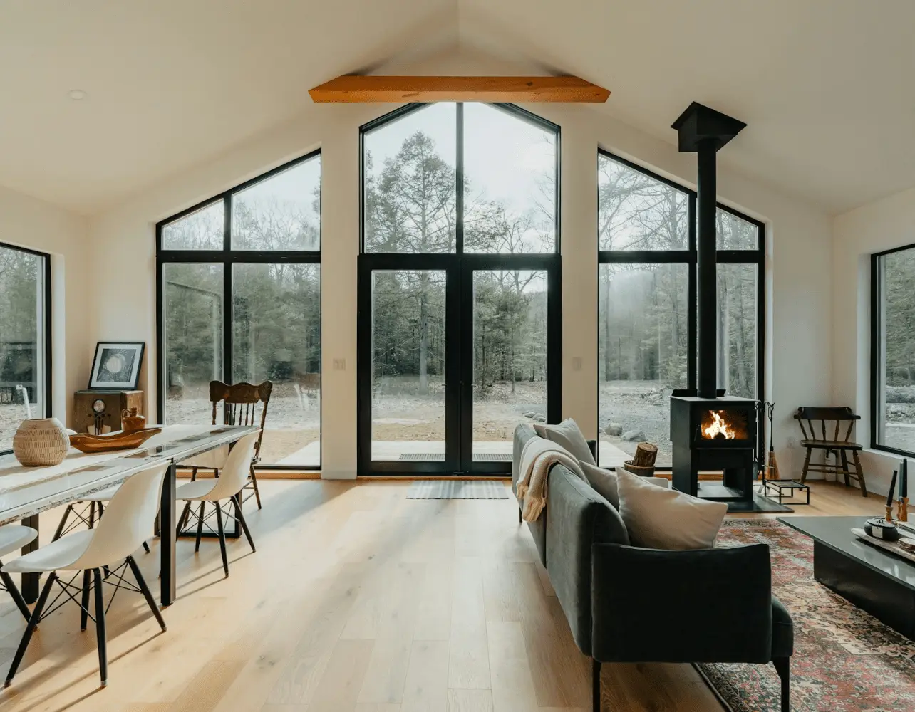 Modern open living space with fireplace and large windows
